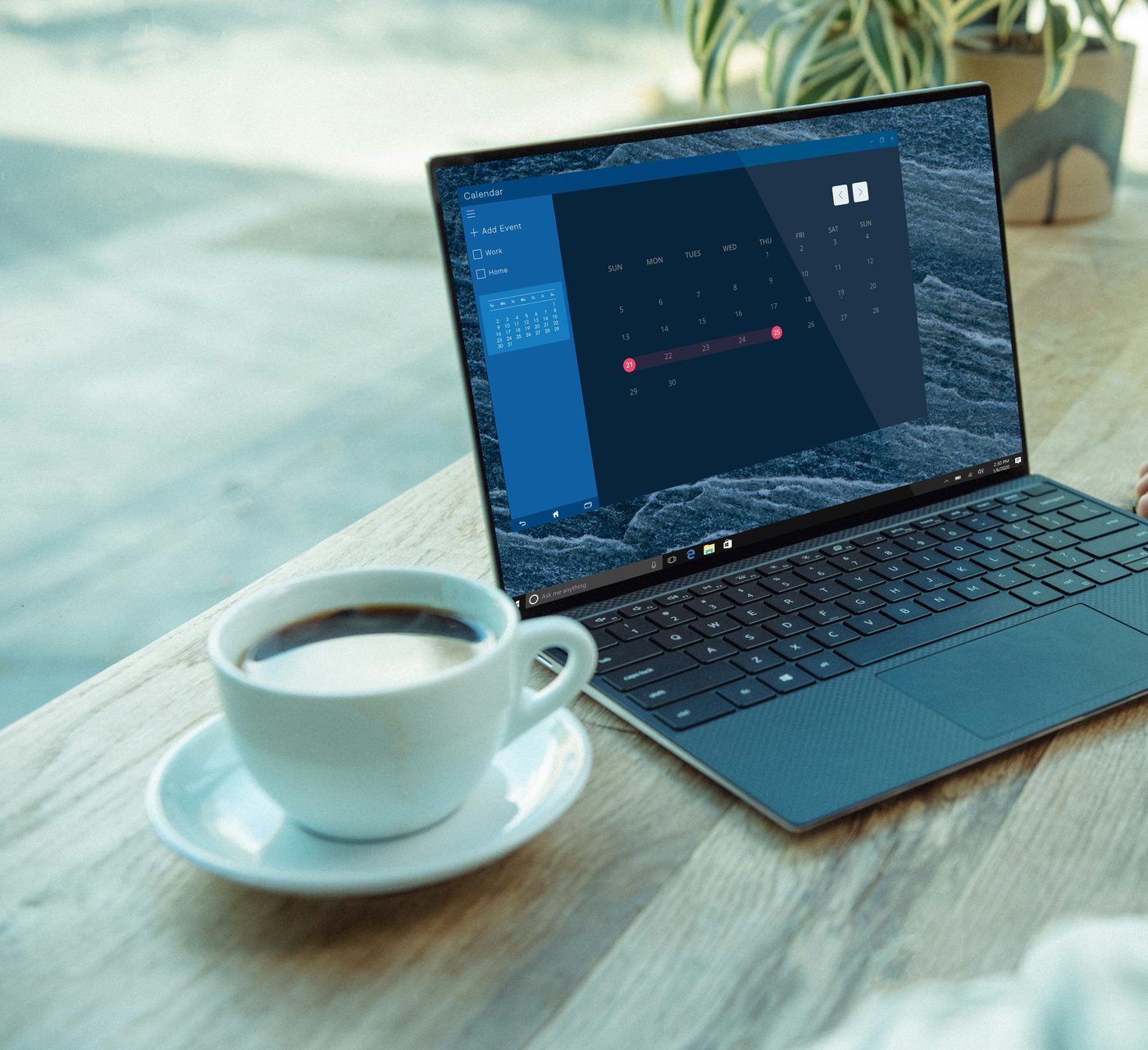 An open laptop and a cup of coffee on a desk